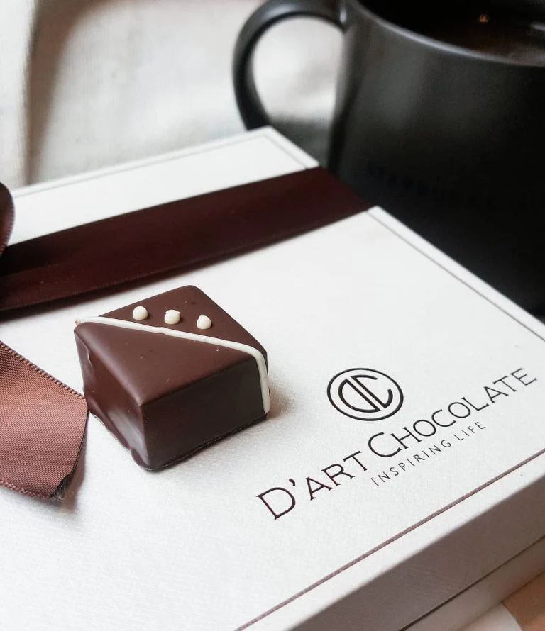 An embossed D'art box with a single bonbon