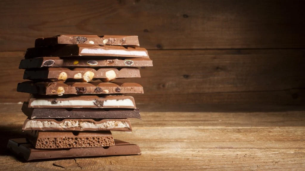 An assortment of D'art bars laid out on wood