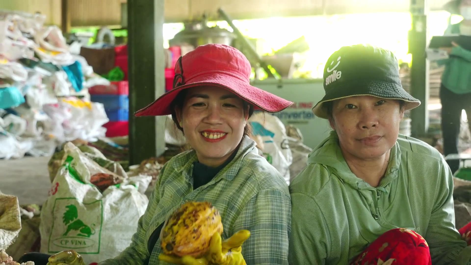 Two farmers at the cacao collection point