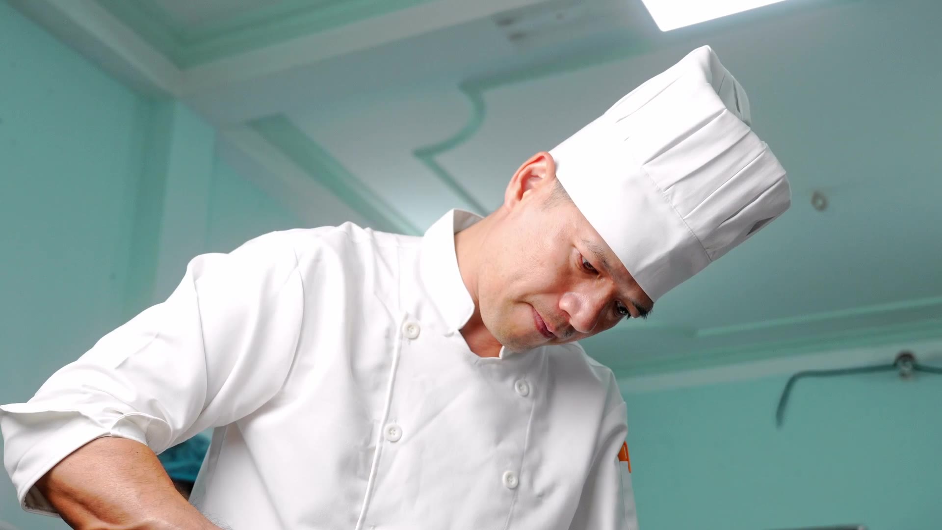 A chocolatier in whites in the production kitchen